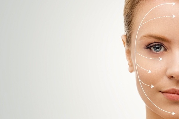 Young, beautiful and healthy woman with arrows on her face