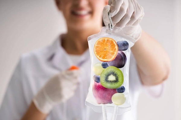 Women holding Nad+ IV Therapy Bag