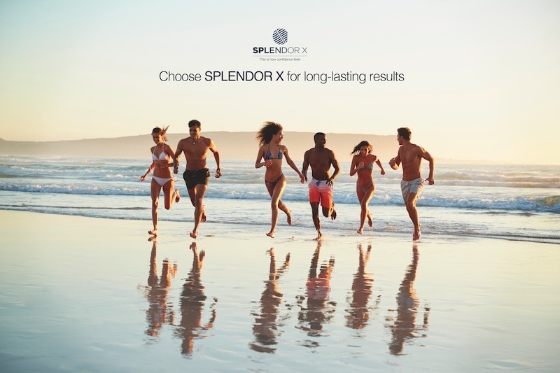 Results of laser hair reduction treatment in Miami. Group of friends run through waves together on beach vacation